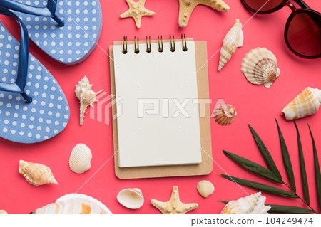 Blank writing book with summer beach accessories on background, copy space. Flat lay with copy space Blank writing book with summer beach accessories on background, copy space. Flat lay with copy space 104249474