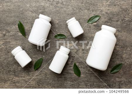 supplement pills with medicine bottle health care and medical top view. Vitamin tablets. Top view mockup bottle for pills and vitamins with green leaves, natural organic bio supplement, copy space supplement pills with medicine bottle health care and medical top view. Vitamin tablets. Top view mockup bottle for pills and vitamins with green leaves, natural organic bio supplement, copy space 104249566