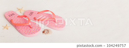 Beach accessories. Flip flops and starfish on colored background. Top view Mock up with copy space Beach accessories. Flip flops and starfish on colored background. Top view Mock up with copy space 104249757