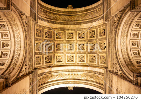 Detailed view of Arc de Triomphe from bottom by night, Paris, France 104250270
