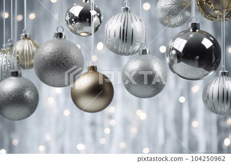 silver and gold christmas balls hanging with defocused lights background 104250962