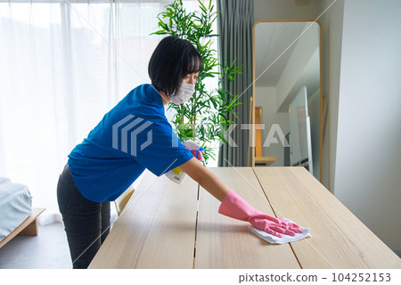 woman cleaning the room woman cleaning the room 104252153