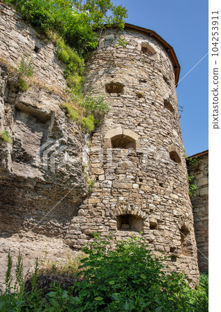 Old stone medieval Russian Gate tower in Kamianets-Podilskyi fortress, Ukraine. 104253911