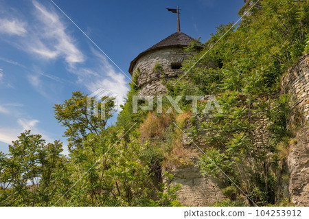 Old stone medieval Russian Gate tower in Kamianets-Podilskyi fortress, Ukraine. 104253912