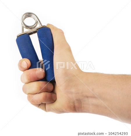 Blue rubber expander for sports, on a white background and in a male hand. A hand squeezes an expander. Forearm and grip 104254293