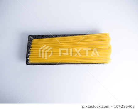 Spaghetti dried noodles before cooking Spaghetti dried noodles before cooking 104256402