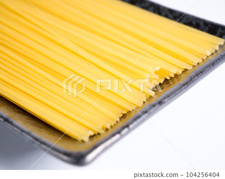 Spaghetti dried noodles before cooking Spaghetti dried noodles before cooking 104256404