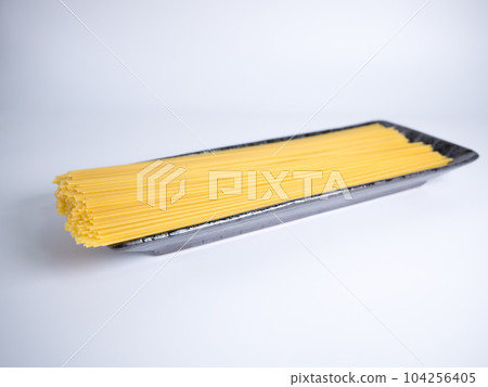 Spaghetti dried noodles before cooking Spaghetti dried noodles before cooking 104256405