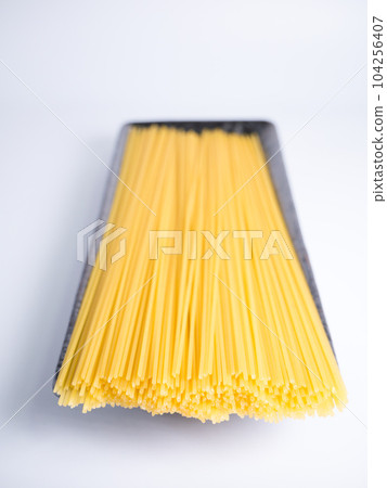 Spaghetti dried noodles before cooking Spaghetti dried noodles before cooking 104256407