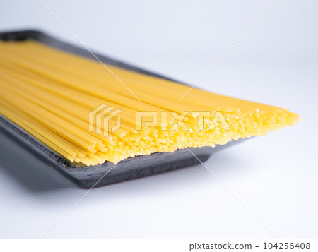 Spaghetti dried noodles before cooking Spaghetti dried noodles before cooking 104256408