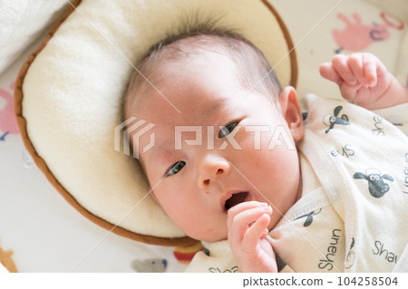 infant sleeping in crib infant sleeping in crib 104258504