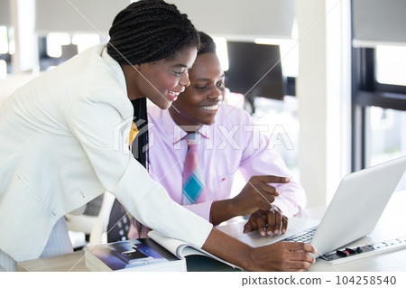 Woman African American leader teaching work analyzing project in company 104258540