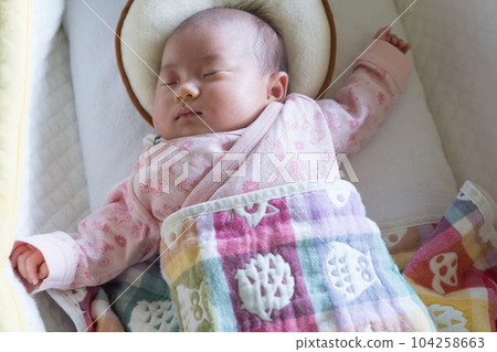 Infant sleeping soundly in crib Infant sleeping soundly in crib 104258663