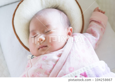 Infant sleeping soundly in crib Infant sleeping soundly in crib 104258667