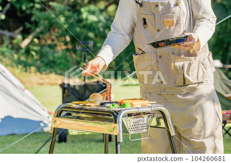 Mom, mother, woman, family, family having a barbecue at the campsite 104260681