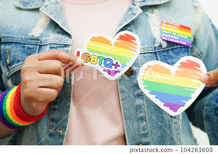 Asian woman with rainbow flag, LGBT symbol rights and gender equality, LGBT Pride Month in June. 104263608