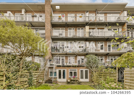 an apartment complex in vancouver, canada with several balks and balks on the second floor there are two balks an apartment complex in vancouver, canada with several balks and balks on the second floor there are two balks 104266395
