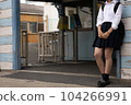 High school girls waiting for people at the station entrance 104266991