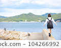High school girl walking on embankment 104266992