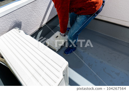 A man cleaning the balcony Balcony A man cleaning the balcony Balcony 104267564