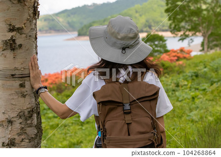 Woman traveling Lake Nozori in early summer Woman traveling Lake Nozori in early summer 104268864