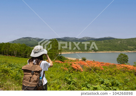 Woman traveling Lake Nozori in early summer Woman traveling Lake Nozori in early summer 104268898