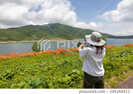 Woman traveling Lake Nozori in early summer Woman traveling Lake Nozori in early summer 104268912