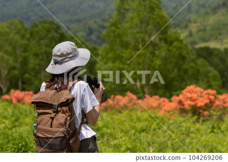 Lake Nozori in early summer, lakeside promenade and female hikers 104269206