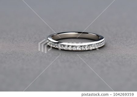 stunning close up shot of a single wedding rings, delicately intertwined to symbolize the everlasting bond of love and commitment. Jewelry gold diamond ring for anniversary, valentine, or engagement. 104269359