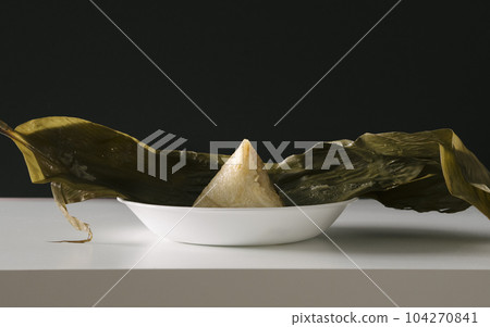 Banana Leaf Wrapped Glutinous Rice Dumpling with Meat Fillings Banana Leaf Wrapped Glutinous Rice Dumpling with Meat Fillings 104270841