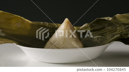 Banana Leaf Wrapped Glutinous Rice Dumpling with Meat Fillings Banana Leaf Wrapped Glutinous Rice Dumpling with Meat Fillings 104270845