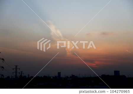 Clouds like mermaids floating in the western sky at dusk 104270965