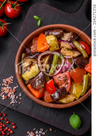 Delicious fresh vegetarian salad with tomatoes, green beans, eggplant and pepper Delicious fresh vegetarian salad with tomatoes, green beans, eggplant and pepper 104271358