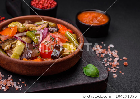 Delicious fresh vegetarian salad with tomatoes, green beans, eggplant and pepper Delicious fresh vegetarian salad with tomatoes, green beans, eggplant and pepper 104271359