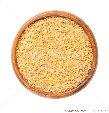 Coarse bulgur, also called burghul, in a wooden bowl. Cracked and parboiled wheat foodstuff, and a common ingredient in many cuisines of West Asia and Mediterranean Basin, with light and nutty flavor. Coarse bulgur, also called burghul, in a wooden bowl. Cracked and parboiled wheat foodstuff, and a common ingredient in many cuisines of West Asia and Mediterranean Basin, with light and nutty flavor. 104271534