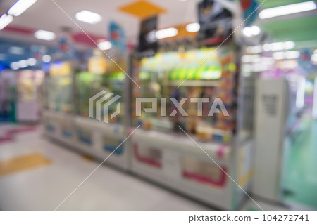 blur image of gachapon machines in arcade game centre 104272741