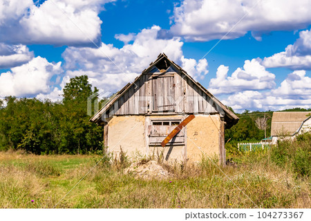 Beautiful old abandoned building farm house in countryside on natural background 104273367