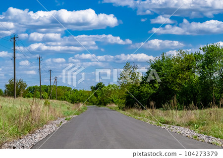 Beautiful empty asphalt road in countryside on colored background 104273379