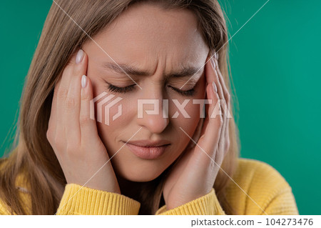Pretty woman is suffered headache. Migraine, massages temples, magnetic storms 104273476