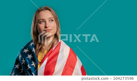 Proud woman with national USA flag on blue background.American patriot,US banner Proud woman with national USA flag on blue background.American patriot,US banner 104273596