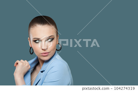 Nice lady portrait. Pretty woman brunette on blue background Nice lady portrait. Pretty woman brunette on blue background 104274319