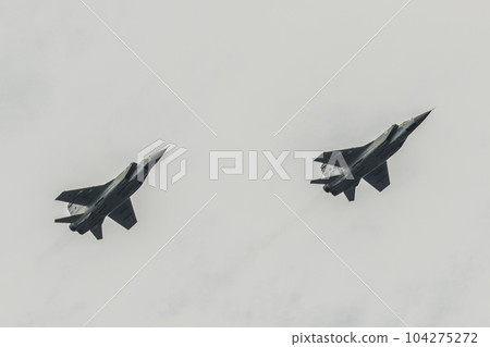 two airplanes mig 31 flying against the sky two airplanes mig 31 flying against the sky 104275272