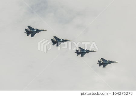 Four multi-purpose fighters SU-27 in the cloudy sky. 104275273