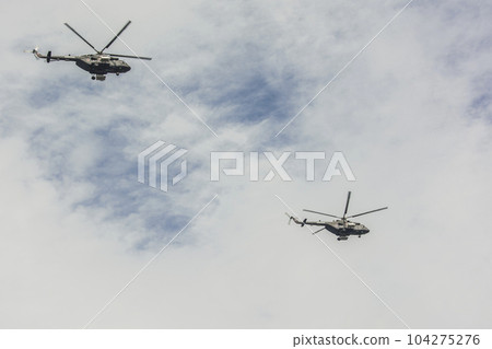 Two Russian MI-8 helicopters against the sky 104275276