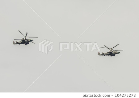 Two military helicopters Ka-52 Alligator Air Force VCS of Russia fly against the sky Two military helicopters Ka-52 Alligator Air Force VCS of Russia fly against the sky 104275278