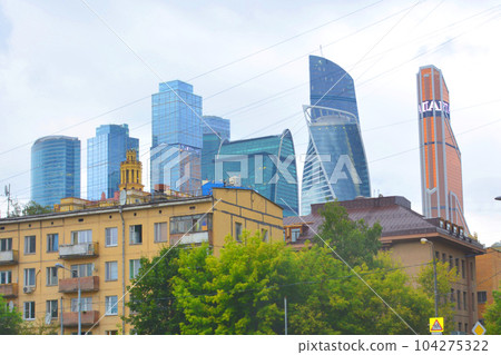 old soviet buildings and modern skyscrapers in different colors 104275322