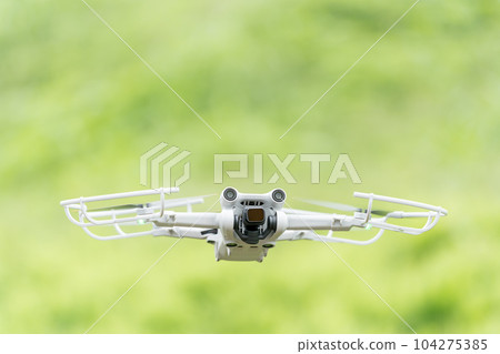 Drone aircraft flying in the fresh green Drone aircraft flying in the fresh green 104275385