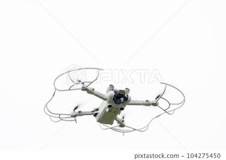 Drone aircraft in flight White background Drone aircraft in flight White background 104275450