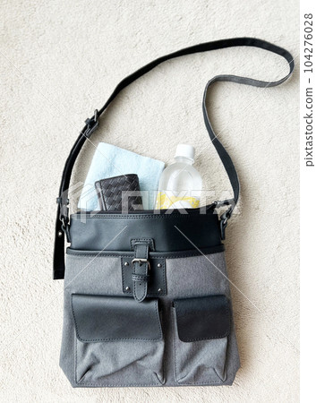 Personal items in a shoulder bag Personal items in a shoulder bag 104276028