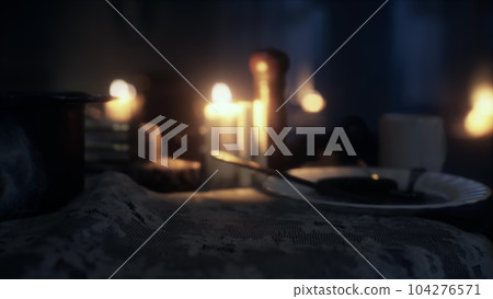 Table setting in candlelight at night Table setting in candlelight at night 104276571